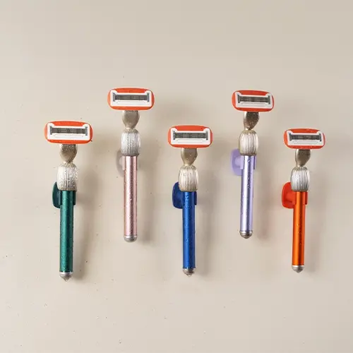fler razor starter set in 5 colors hanging on a wall.webp